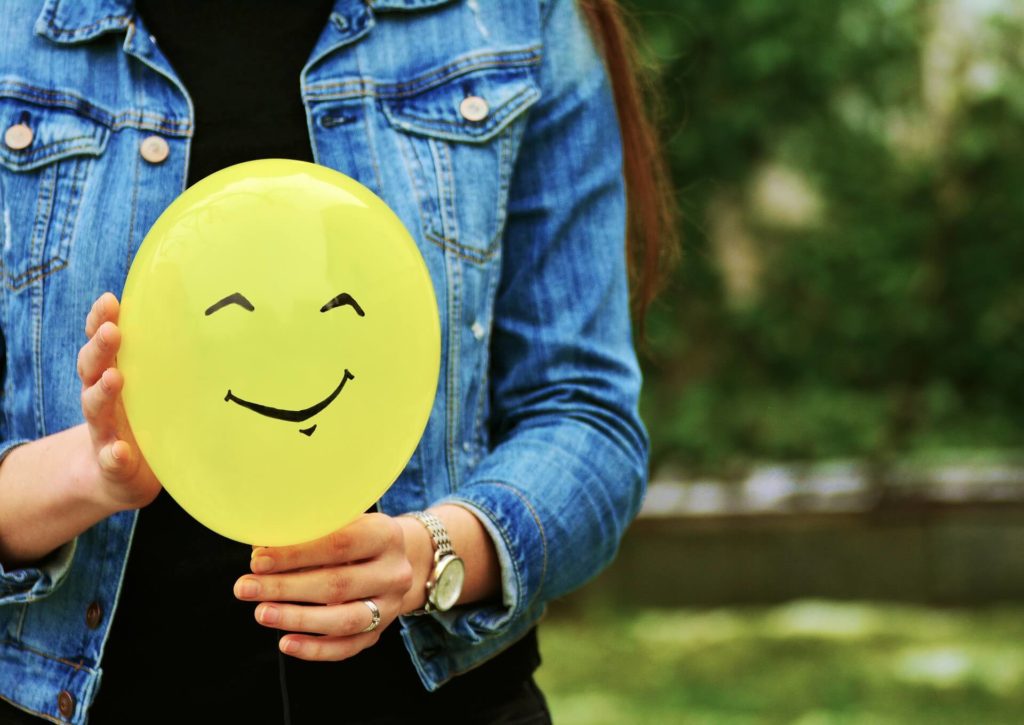 A smiley face drawn on a balloon.